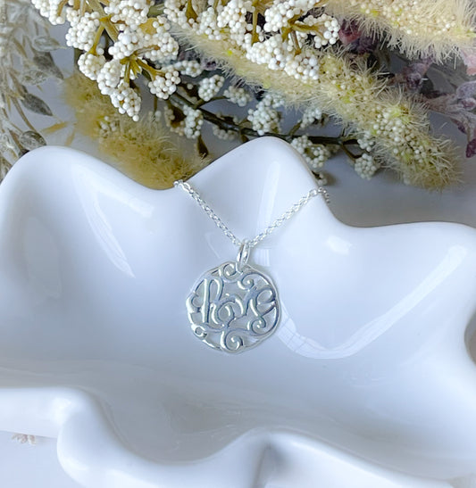 Sterling silver love charm necklace